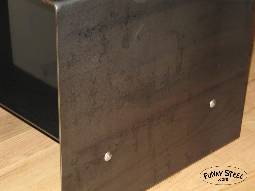 Raw steel finish irregularities with custom finish clear coat bent plate tables